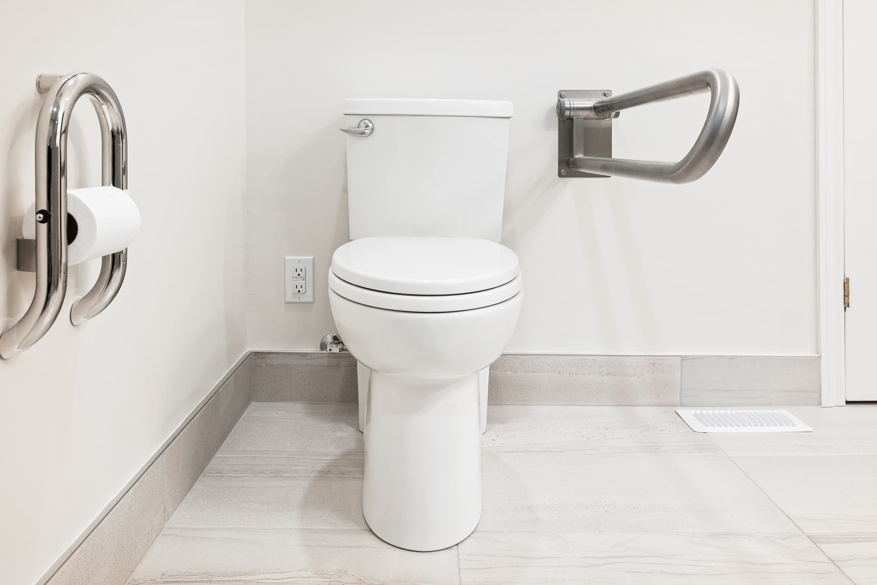 bathroom with a shower chair